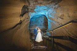 nottingham castle wedding photography bride groom in caves with creative gels on steps